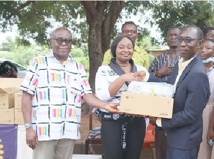 Rita Donkubari (2nd from left), President, Accra North Rotary Club, presenting a projector to Kean Adjei Appiah, Municipal Director of Education, La-Nkwantanang Madina Municipality